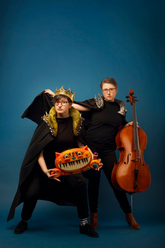 ser Malena-Webber and Aubrey Turner of the Doubleclicks dressed in capes and crowns.