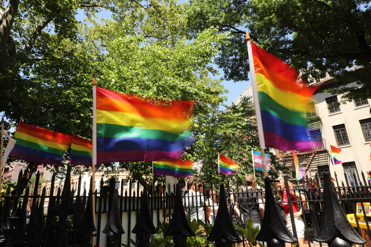 Rainbow pride flags fly outside the Stonewall Inn as crowds begin to gather to celebrate Pride Month on June 26, 2019 in New York City. Thousands of members of the LGBTQ community have been gathering outside of the historic gay bar in Greenwich Village to celebrate the 50th anniversary of riots at the inn, which many people consider the birth of the modern gay rights movement in America. (Photo by Spencer Platt/Getty Images)