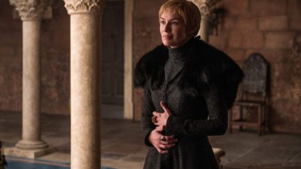 Actress Lena Headey in Game of Thrones as Cersei Lannister holding her baby