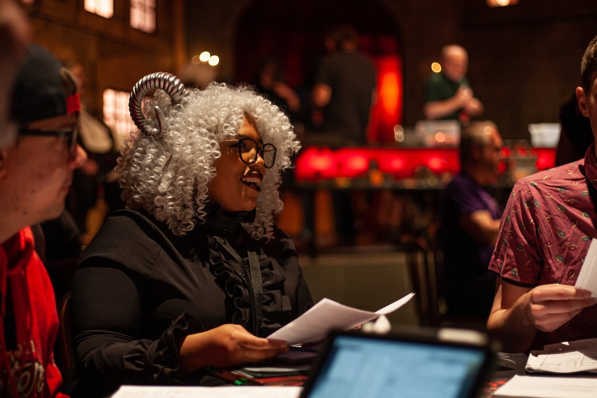 A black woman plays D&D in cosplay.
