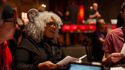 A black woman plays D&D in cosplay.