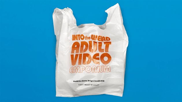 Plastic bag reading 'Into the Weird Adult Video Emporium'
