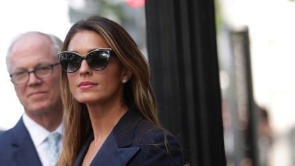 Hope Hicks smiles in sunglasses following her closed-door interview with Congress.