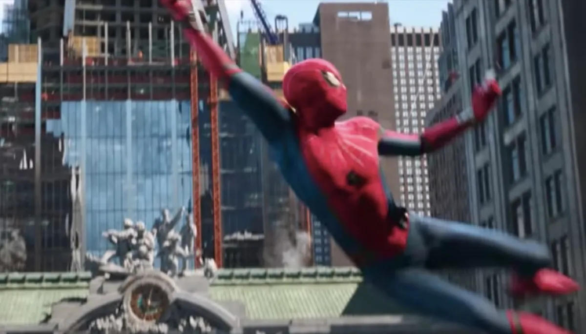Spider-Man swinging in front of Avengers tower in Spider-Man: Far From Home.