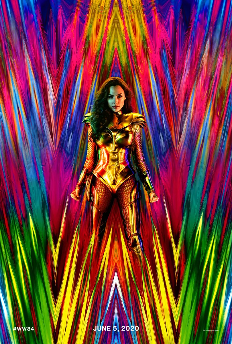 Wonder Woman 1984 poster shows Wonder Woman in a suit of armor against a spiky, rainbow-colored backdrop that looks like WW.
