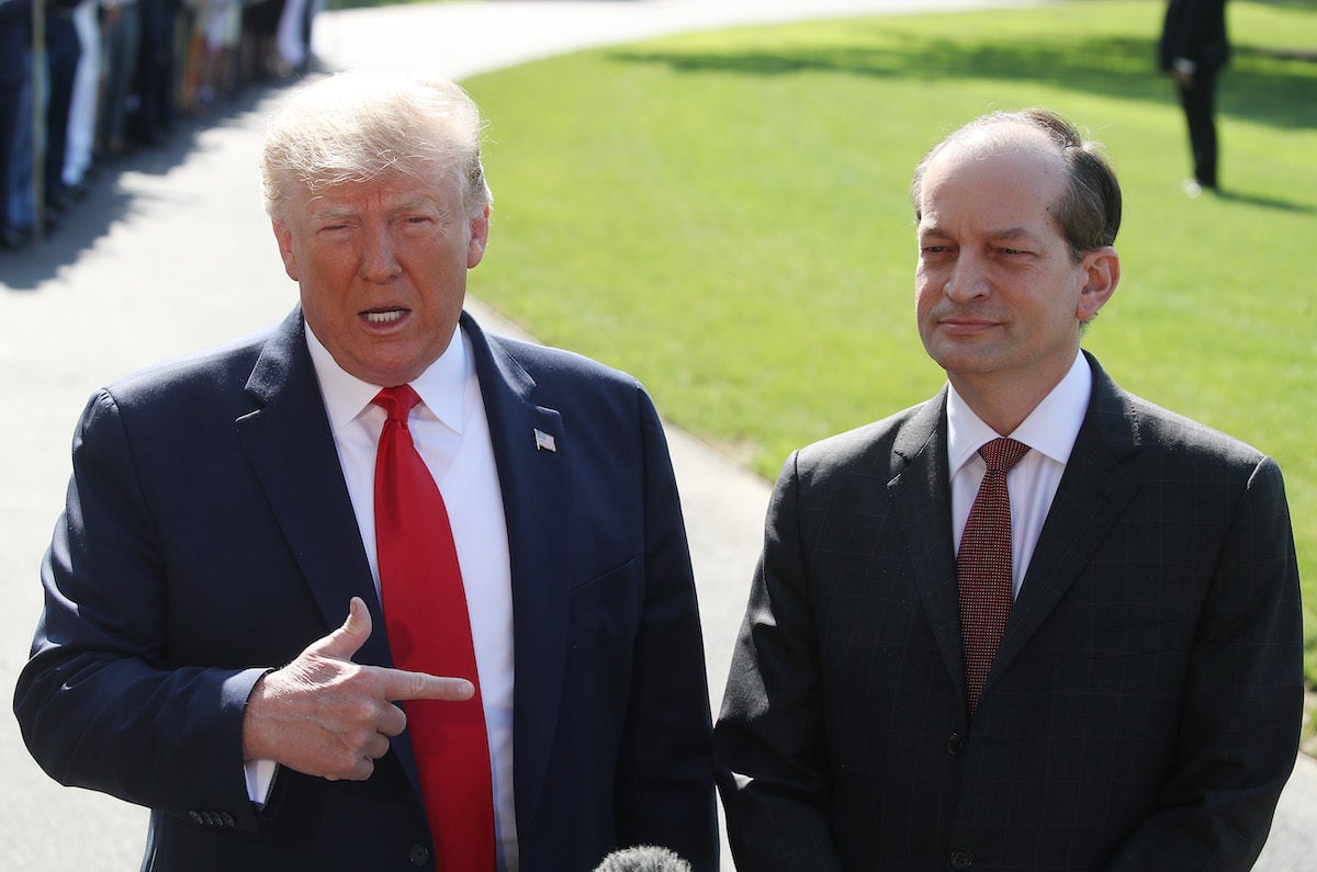 Trump defends Alex Acosta in front of reporters outside the White House.