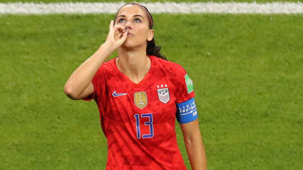 Alex Morgan of the USA celebrates a goal against England by miming tea.