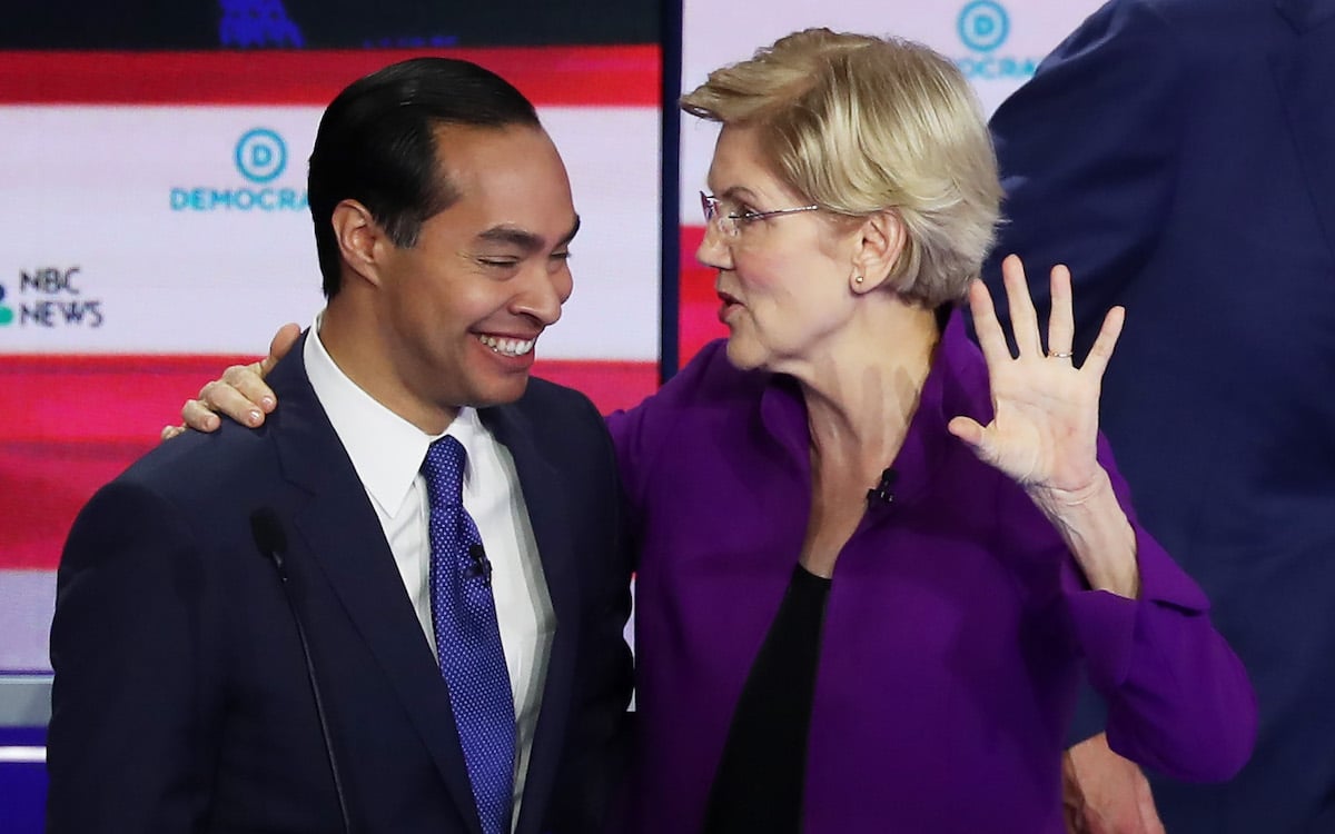 Julian Castro and Elizabeth Warren laugh together after the first Democratic primary debate.