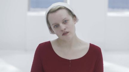 The Handmaid's Tale's June (Elizabeth Moss) stares vacantly in a white room.