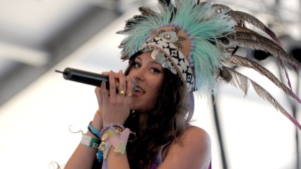 Singer Eliza Doolittle performs at Coachella in an elaborate feathered headdress.