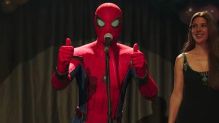 Spider-Man gives double thumbs up onstage in Spider-Man: Far From Home.