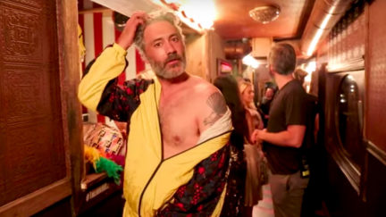 Taika Waititi with an off the shoulder look