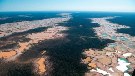 An aerial view over a chemically deforested area of the Amazon jungle caused by illegal mining activities in the river basin of the Madre de Dios region in southeast Peru, on May 17, 2019, during the 'Mercury' joint operation by Peruvian military and police ongoing since February 2019. - Illegal mining activities for gold have caused irreversible ecological damage to more than 11,000 hectares of Amazonian forest and river basins, generating illicit activities in parallel such as human trafficking, mercury trafficking, hired killers and prostitution. (Photo by Cris BOURONCLE / AFP) (Photo credit should read CRIS BOURONCLE/AFP/Getty Images)