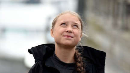 Teenage climate activist Greta Thunberg looks up at the sky.