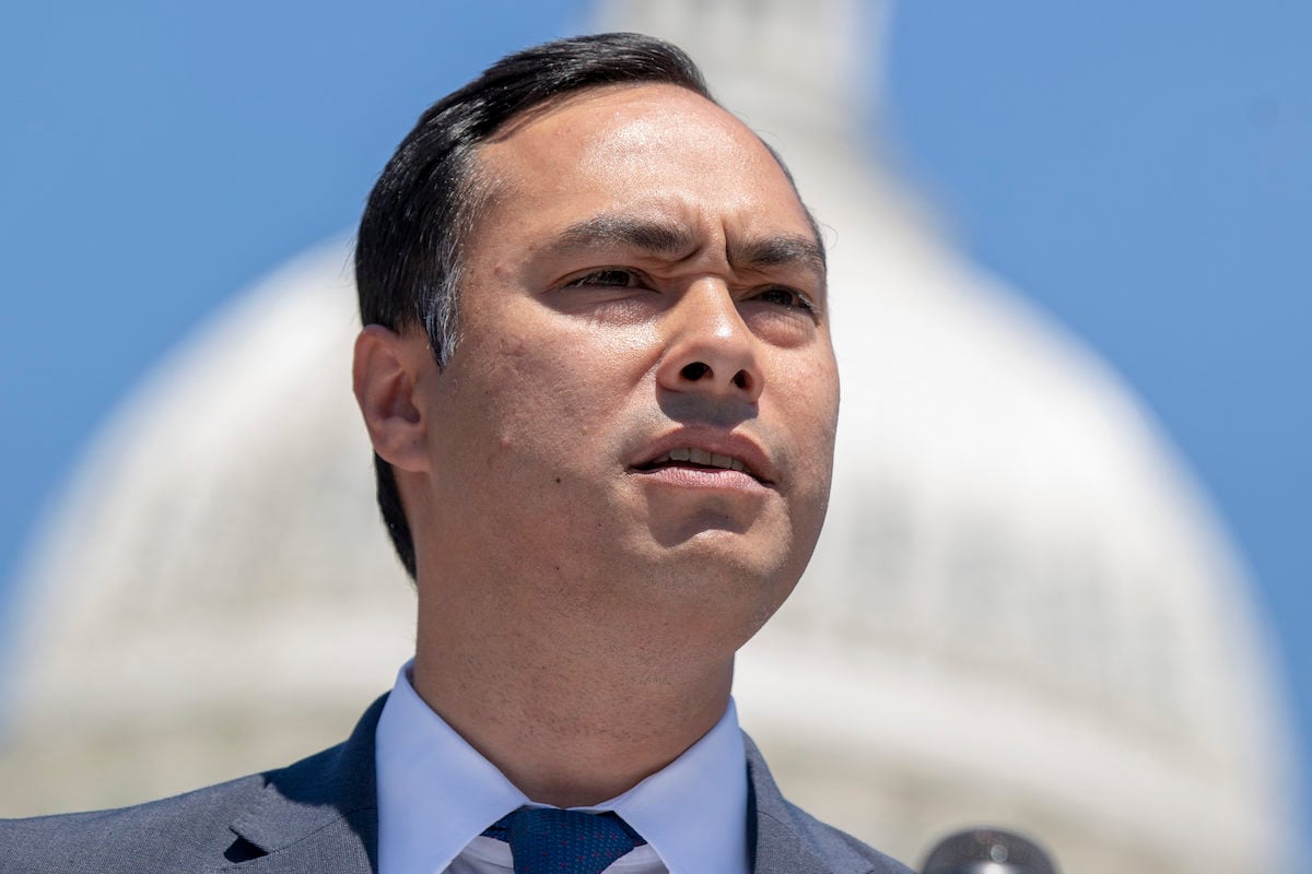 Rep. Joaquin Castro speaks with the Capitol Building in the background.