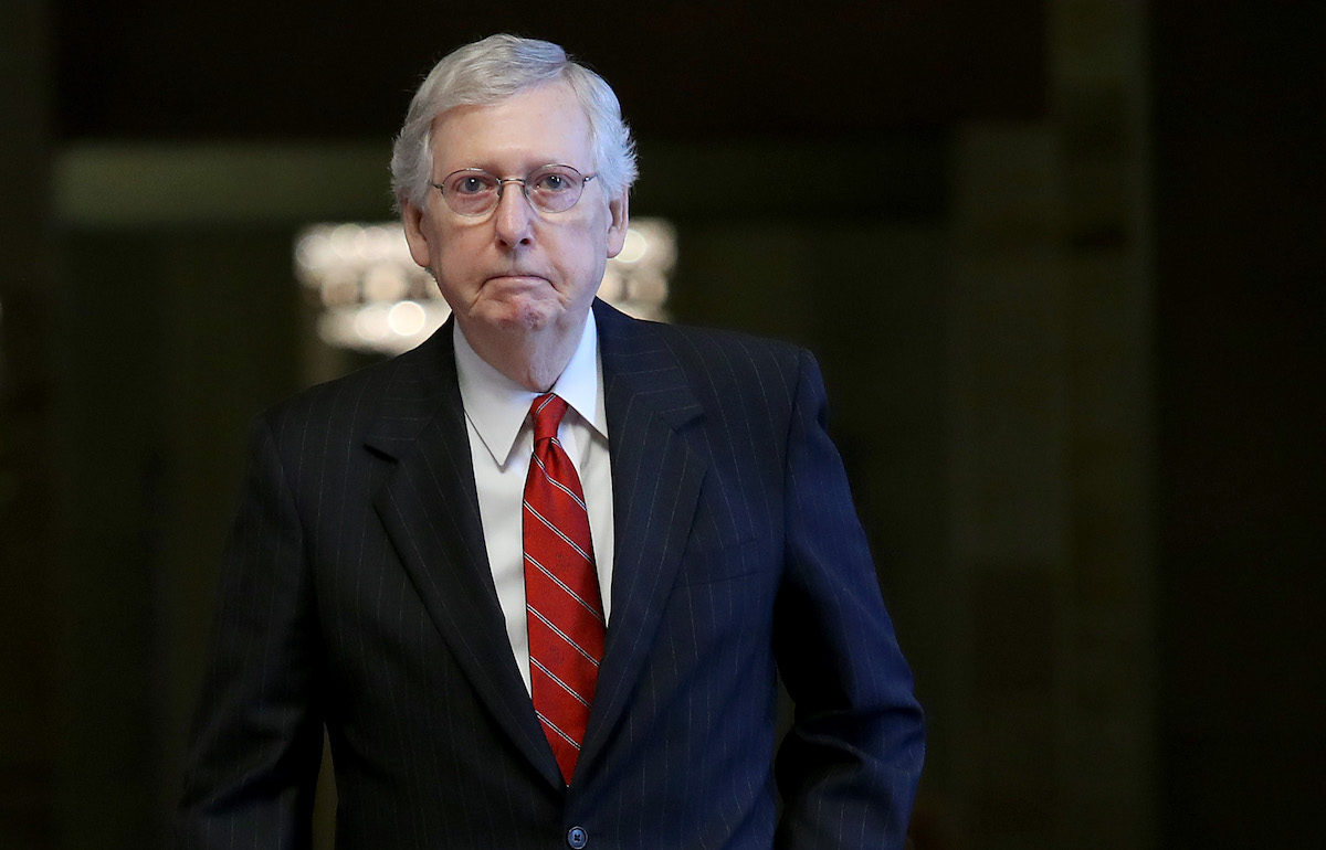 Mitch McConnell, the absolute worst, walks through the Capitol Building.