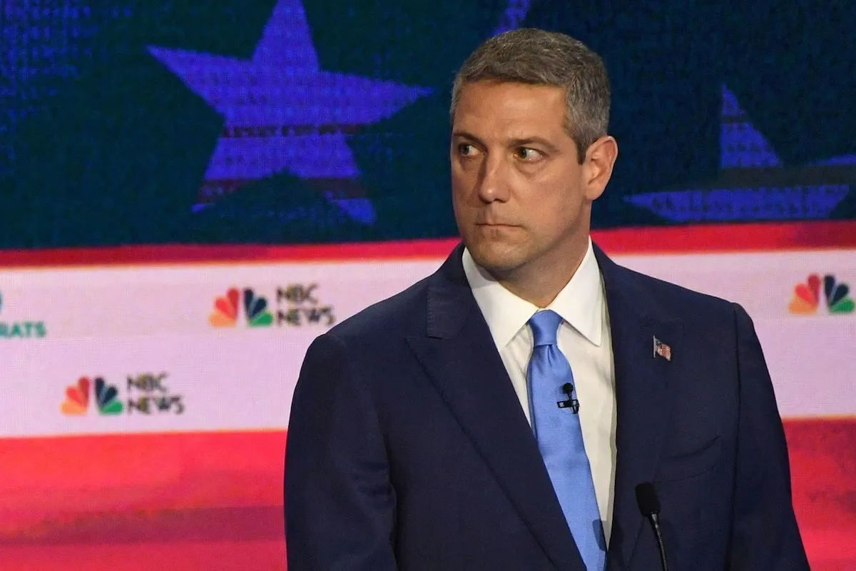 Rep Tim Ryan stares blankly during the Democratic debate.