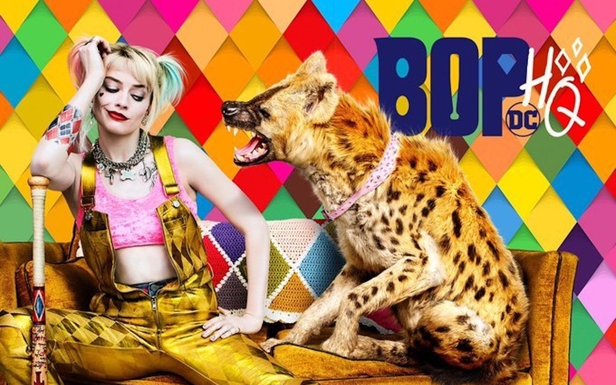 Harley Quinn sits on a yellow sofa with a hyena in the Birds of Prey poster.