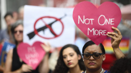 Protestors take part in a rally of Moms against gun violence.