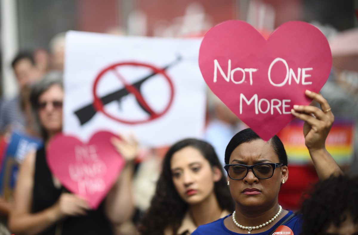 Protestors take part in a rally of Moms against gun violence.