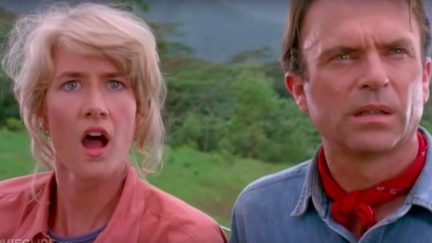 Sattler and Grant looking surprised as they stare at dinosaurs for the first time in Jurassic Park.