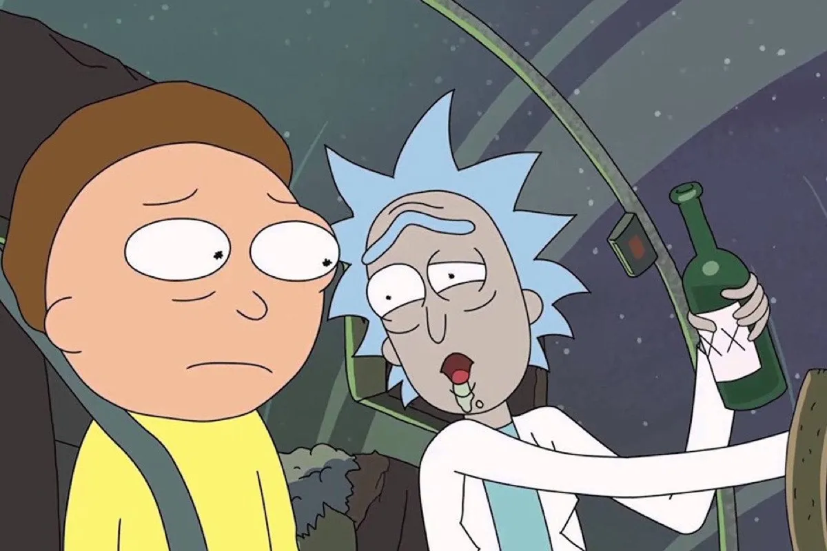 Morty, in the passenger seat of a spacecraft, worriedly watches a drunk Rick pilot it.