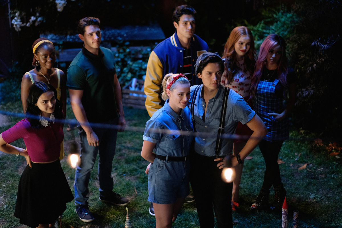 Riverdale -- "Chapter Fifty-Eight: In Memoriam" -- Image Number: RVD401b_0209.jpg -- Pictured (L-R): Camila Mendes as Veronica, Ashleigh Murray as Josie, Casey Cott as Kevin, Charles Melton as Reggie, Lili Reinhart as Betty, Cole Sprouse as Jughead, Madelaine Petsch as Cheryl and Vanessa Morgan as Toni