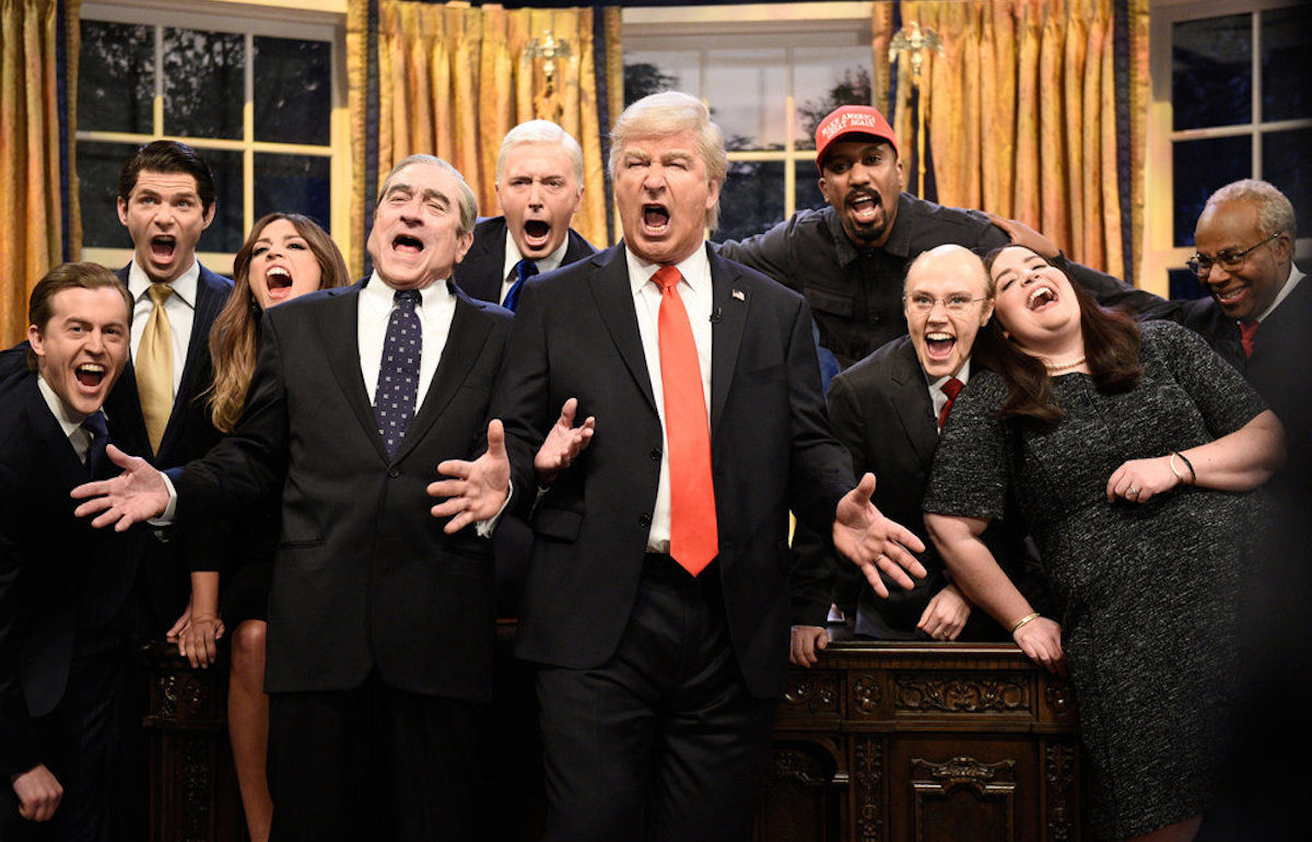 The cast of SNL dressed up as the members of the Trump administration, singing.