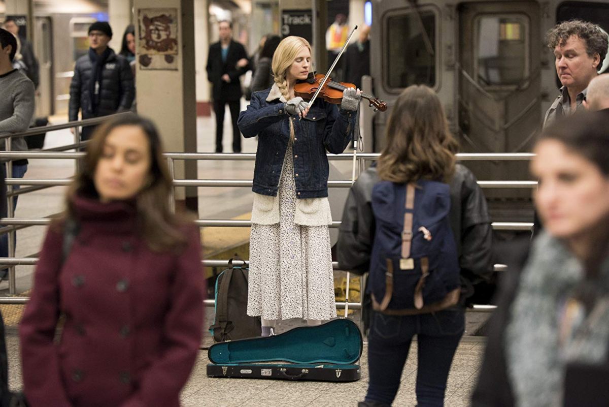 Brit Marling play violin in a train station on the OA