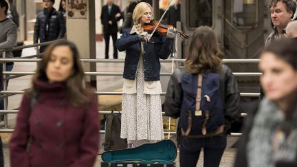 Brit Marling play violin in a train station on the OA