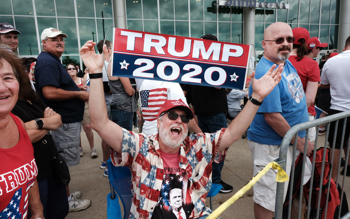 Donald Trump supporters gather outside of an arena