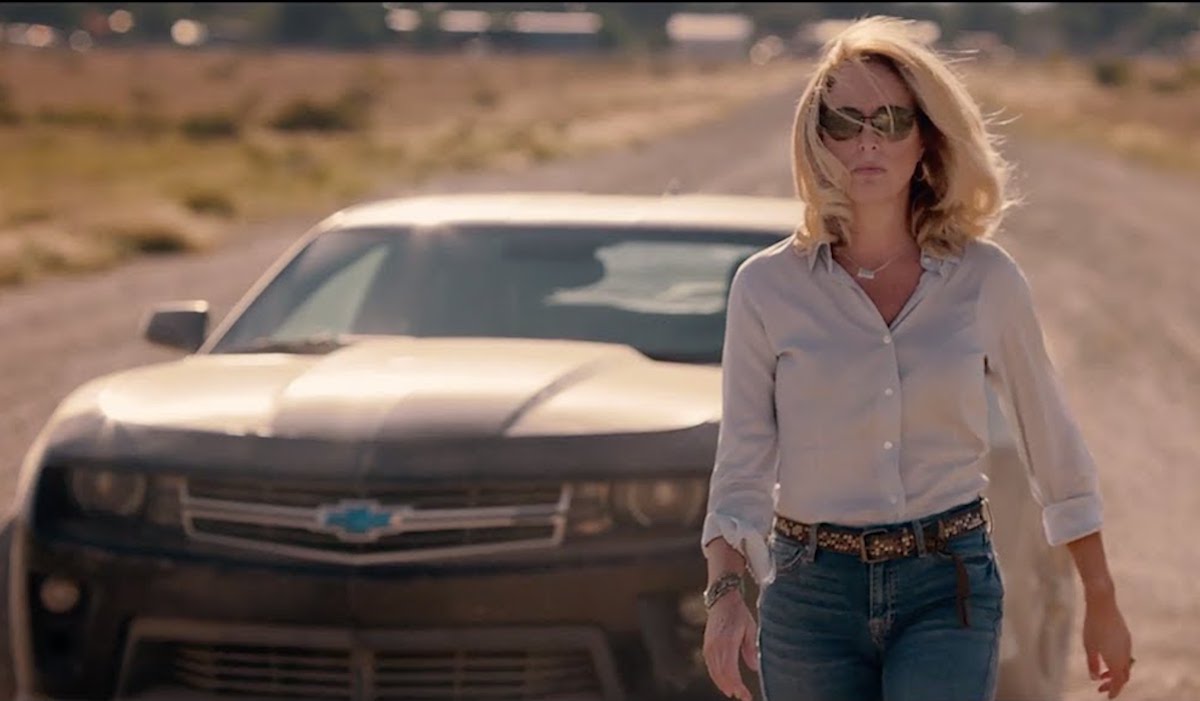 Valerie Plame walks away from a Camaro like an action star.