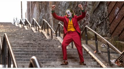 Joker dancing on the stairs.