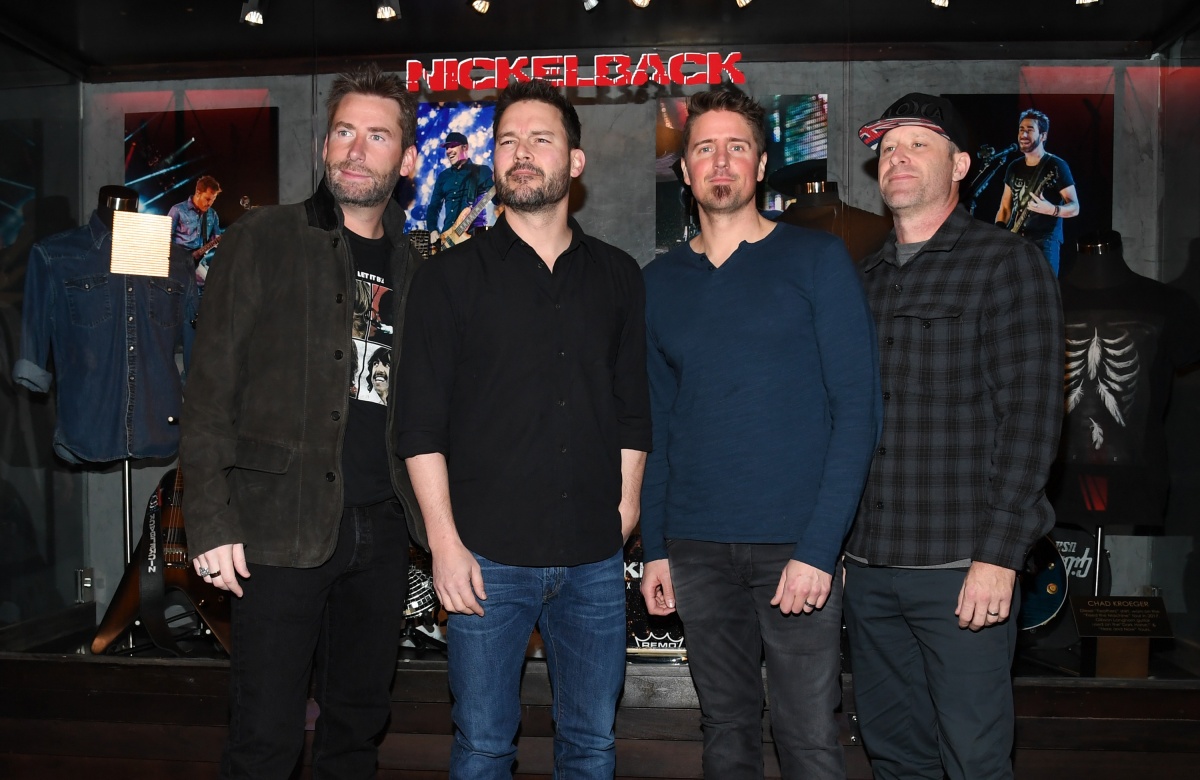 Nickelback Memorabilia Case Dedication At The Hard Rock LAS VEGAS, NV - FEBRUARY 22: (L-R) Frontman Chad Kroeger, guitarist Ryan Peake, drummer Daniel Adair and bassist Mike Kroeger of Nickelback attend a memorabilia case dedication ahead of the band's five-night "Feed the Machine" residency at The Joint inside the Hard Rock Hotel & Casino on February 22, 2018 in Las Vegas, Nevada. (Photo by Ethan Miller/Getty Images)