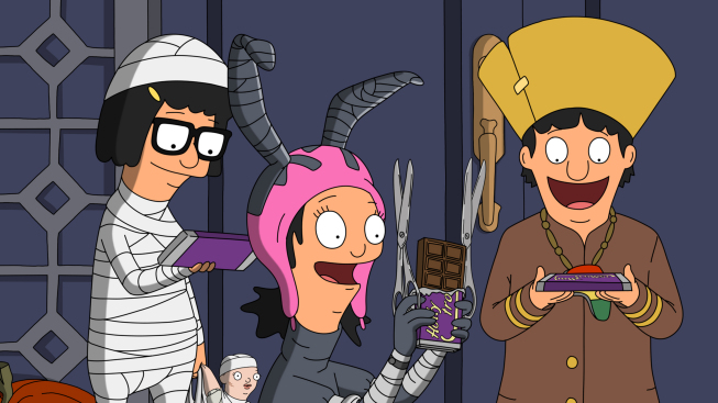 Tina, Louise, and Gene in Halloween costumes with candy in a Halloween episode of Bob's Burgers.