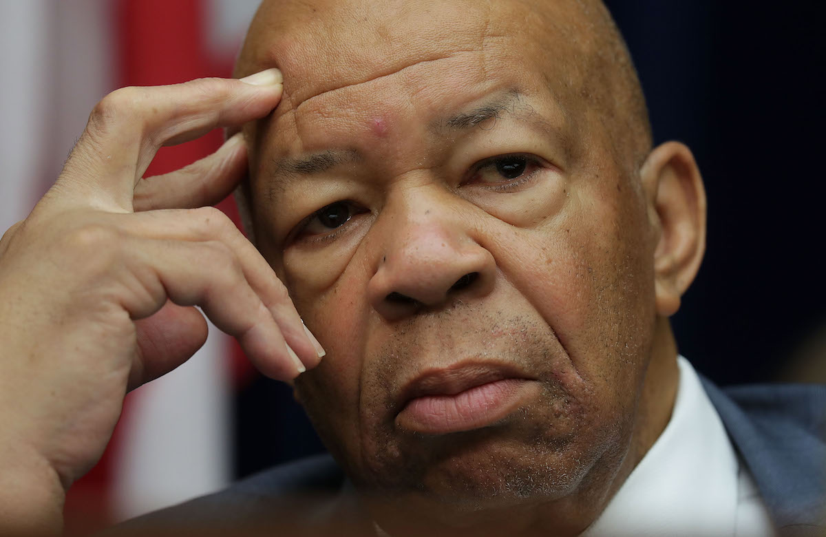 Rep. Elijah Cummings rests his temple to his fingers thoughtfully.