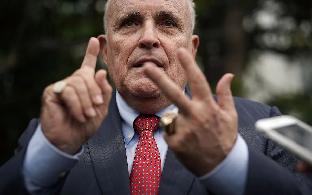 Rudy Giuliani counts on his fingers.