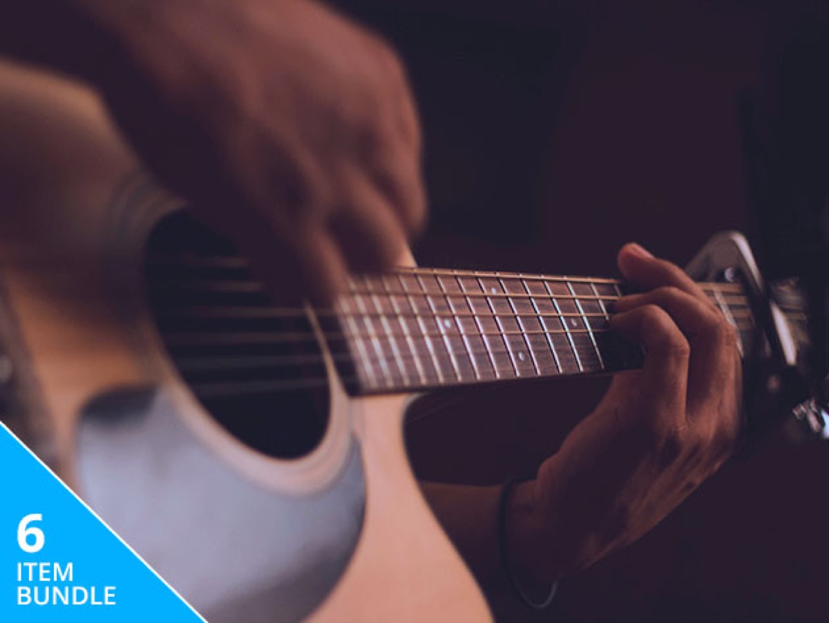 Guitar playing closeup.