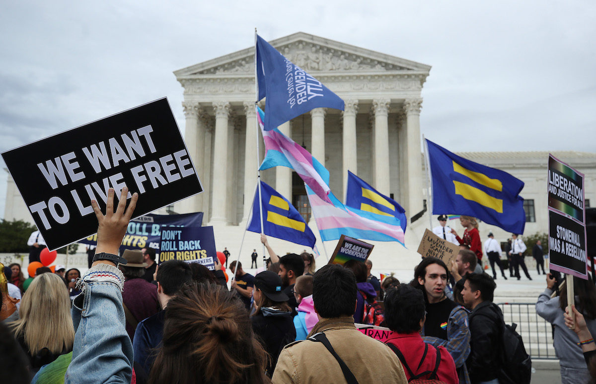 LGBTQ activists protest in front of the U.S. Supreme Court