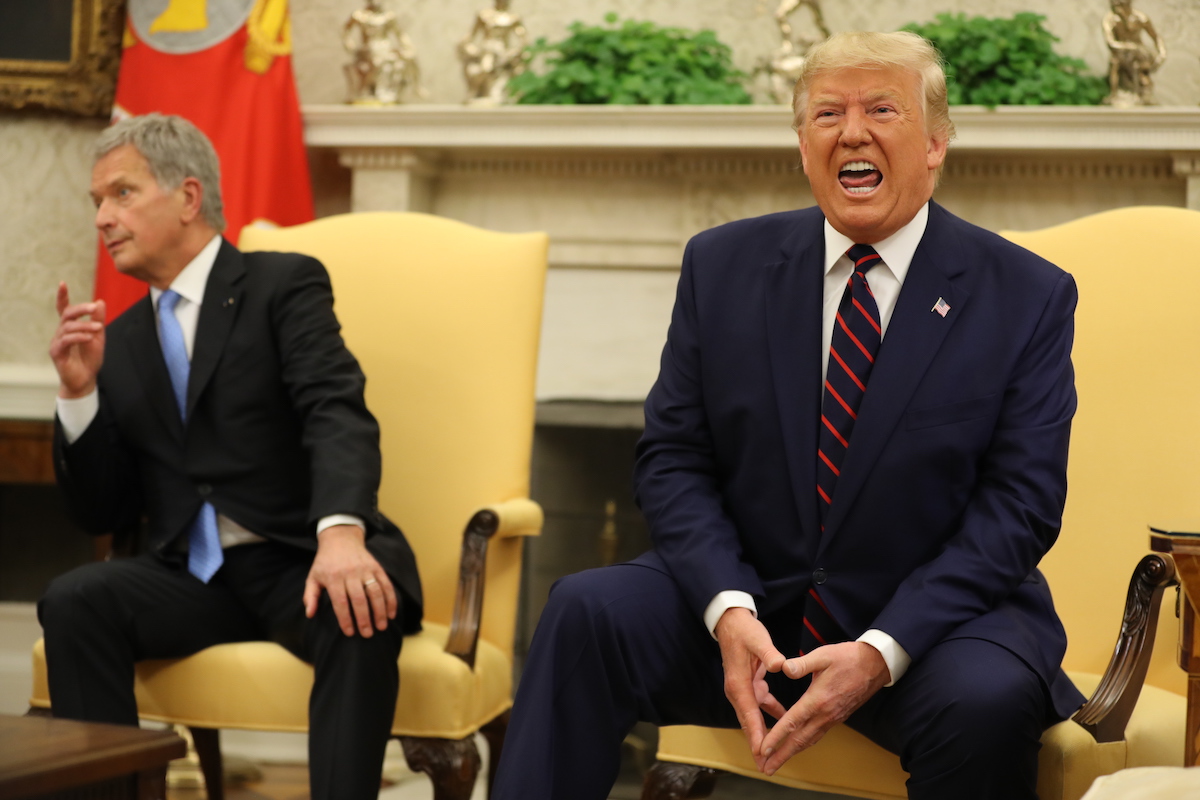 Donald Trump yells in the Oval Office, sitting next to Finnish President Sauli Niinisto, who looks trapped.