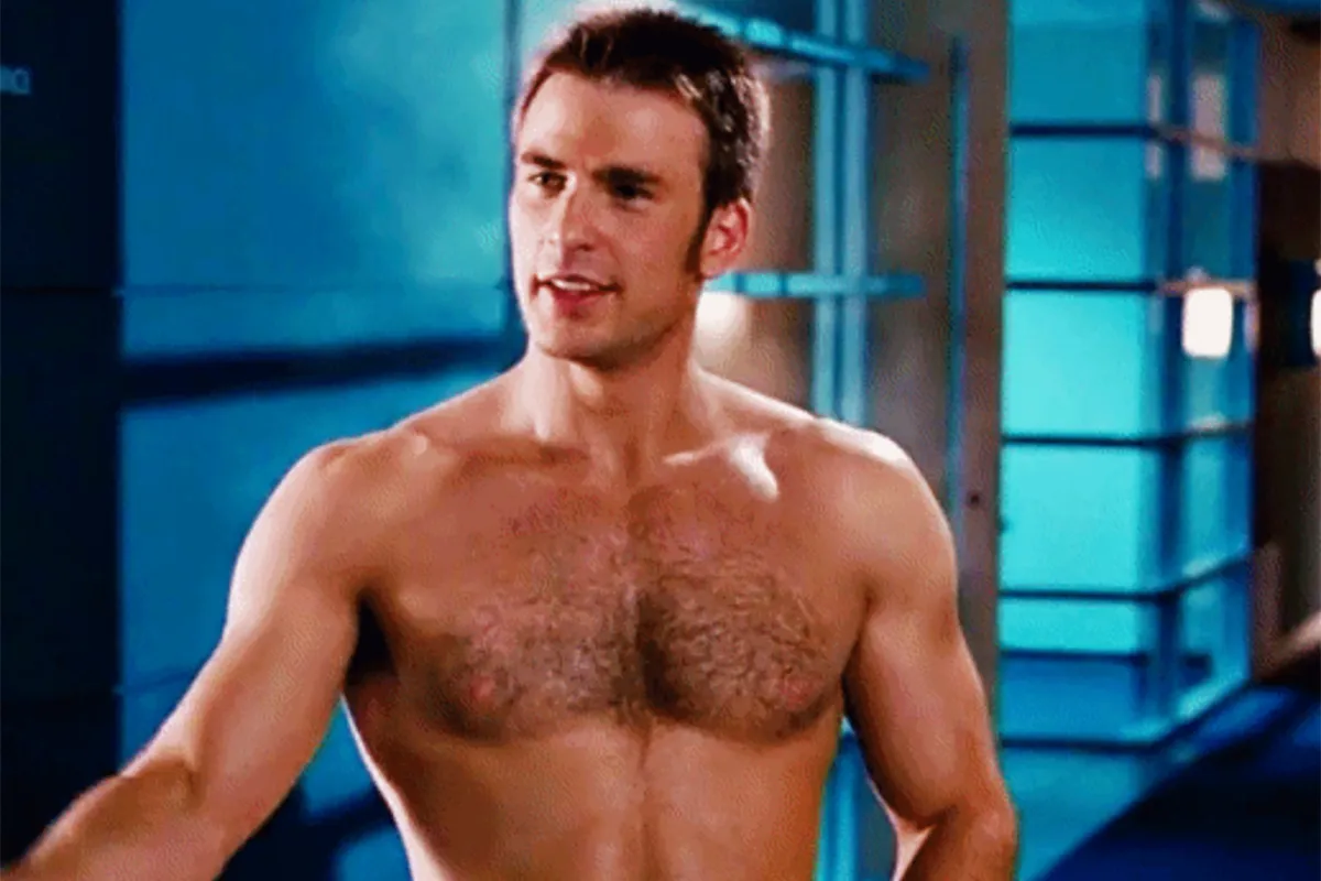 Chris Evans standing shirtless in a hallway