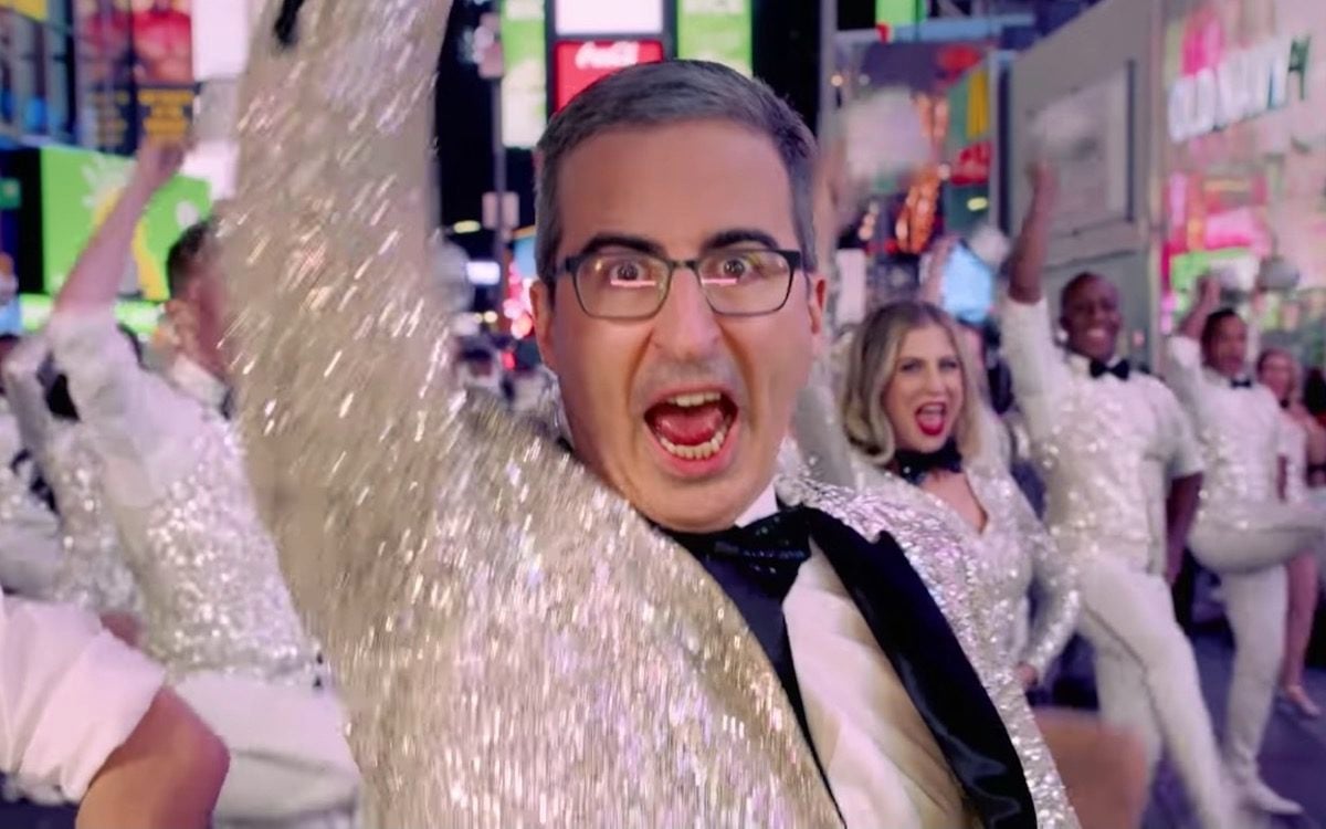 John Oliver sings and dances in a sparkly tuxedo.