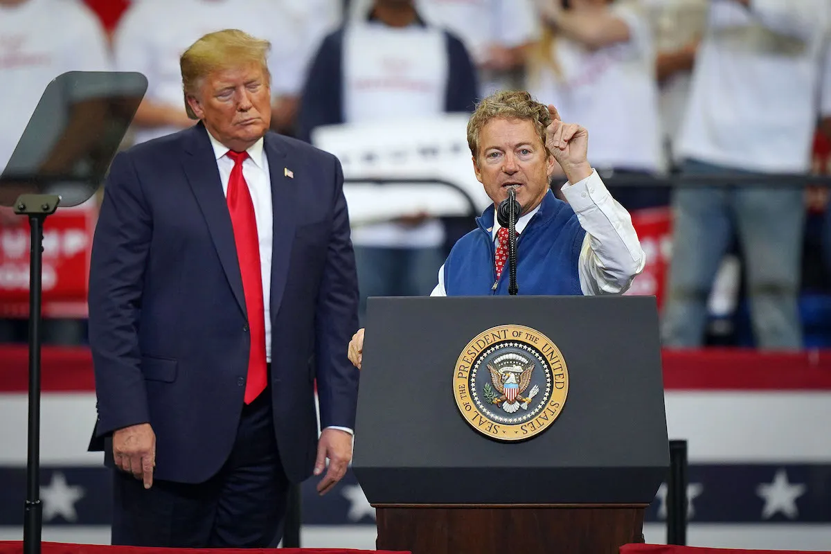 Rand Paul rants from the stage at a rally next to Donald Trump