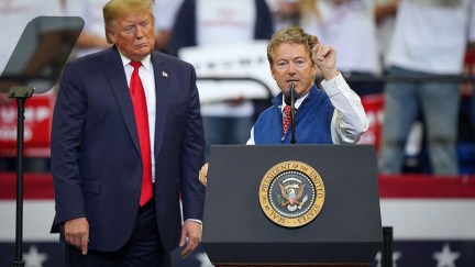 Rand Paul rants from the stage at a rally next to Donald Trump