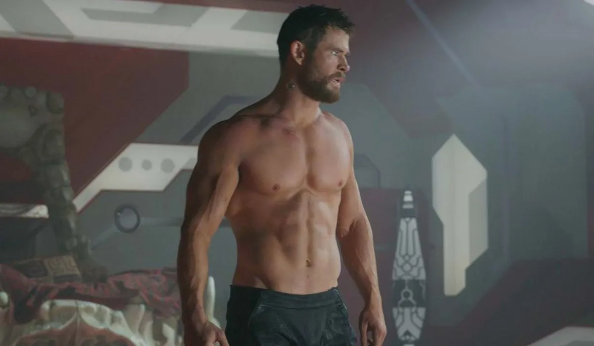 Shirtless Chris Hemsworth standing in Thor: Ragnarok