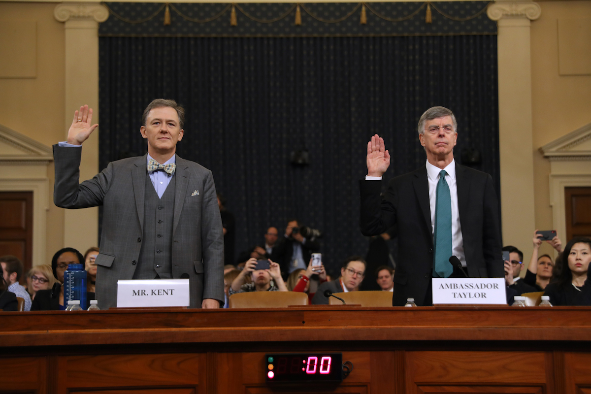 Deputy Assistant Secretary for European and Eurasian Affairs George P. Kent (L) and top U.S. diplomat in Ukraine William B. Taylor Jr. are sworn in before testifying before the House Intelligence Committee