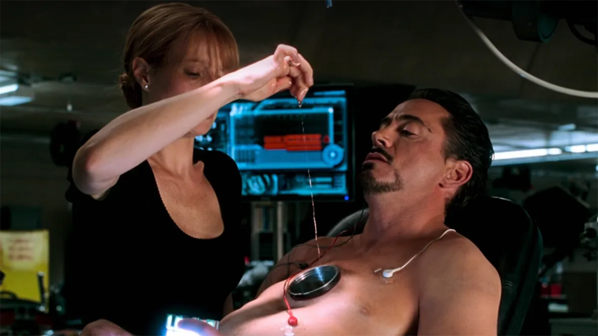 robert downey jr and gwenyth paltrow together in the lab in iron man