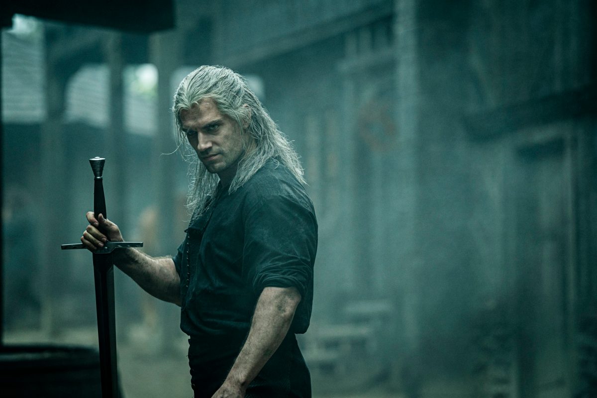 Henry Cavil scowls in a dark city in the witcher