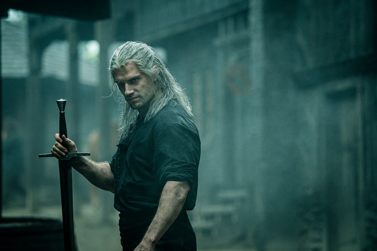 Henry Cavil scowls in a dark city in the witcher