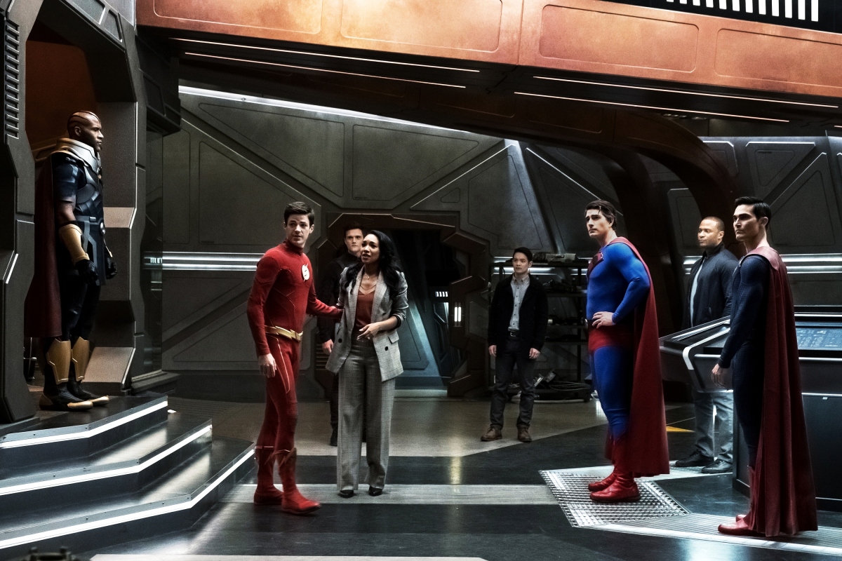 The Flash -- "Crisis on Infinite Earths: Part Three" -- Image Number: FLA609a_0007b3.jpg -- Pictured (L-R): LaMonica Garret as The Monitor, Grant Gustin as Barry Allen/The Flash, Hartley Sawyer as Dibny/Elongated Man, Candice Patton as Iris West - Allen, Osric Chau as Ryan Choi, Brandon Routh as Superman, David Ramsey as John Diggle/Spartan and Tyler Hoechlin as Superman -- Photo: Katie Yu/The CW -- © 2019 The CW Network, LLC. All Rights Reserved.